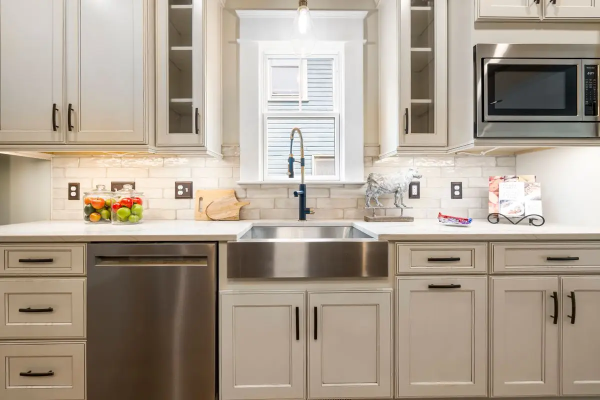 A bright residential kitchen with cabinets and counters. St. Petersburg.